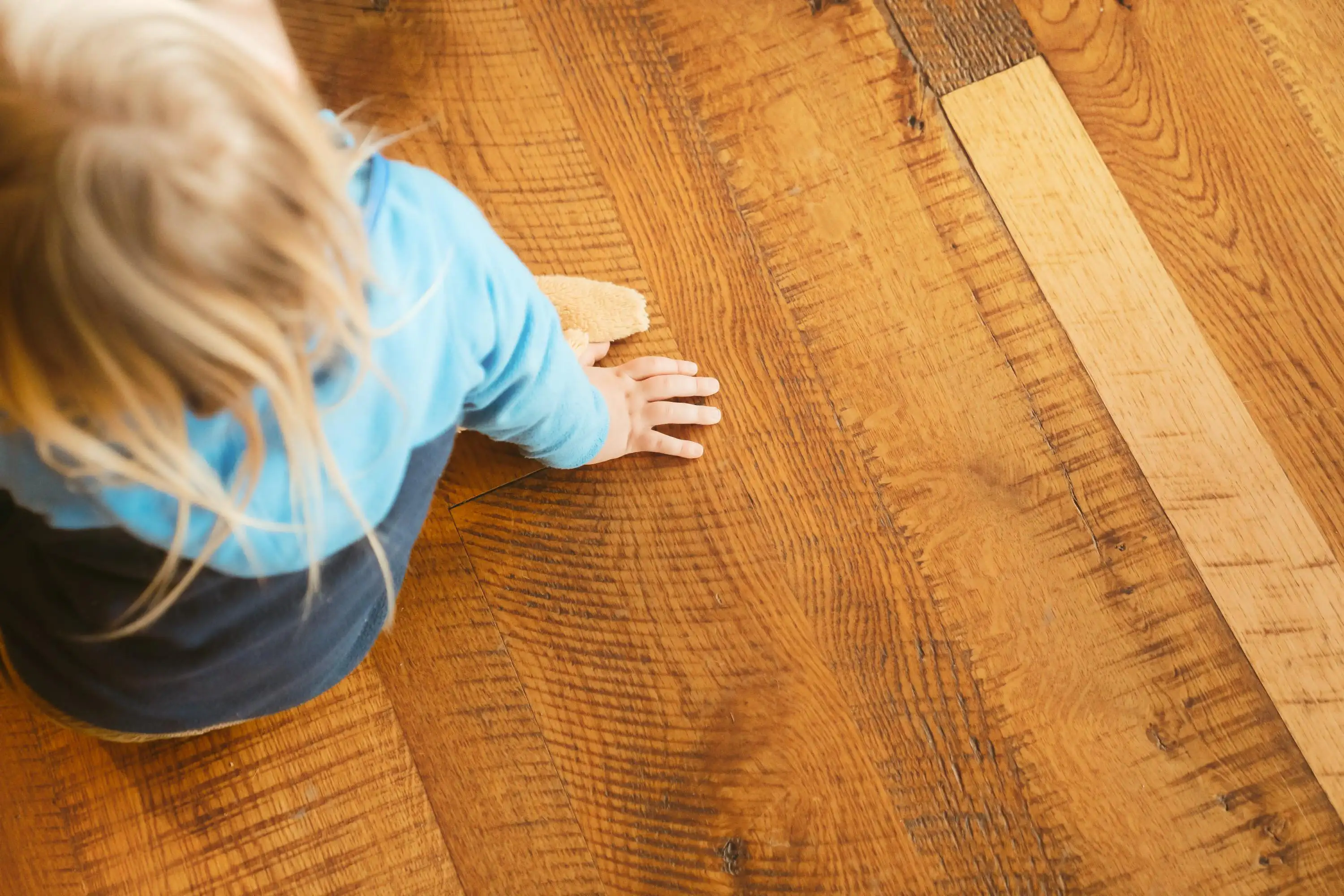 Child playing on hardwood floors in Port Angeles home