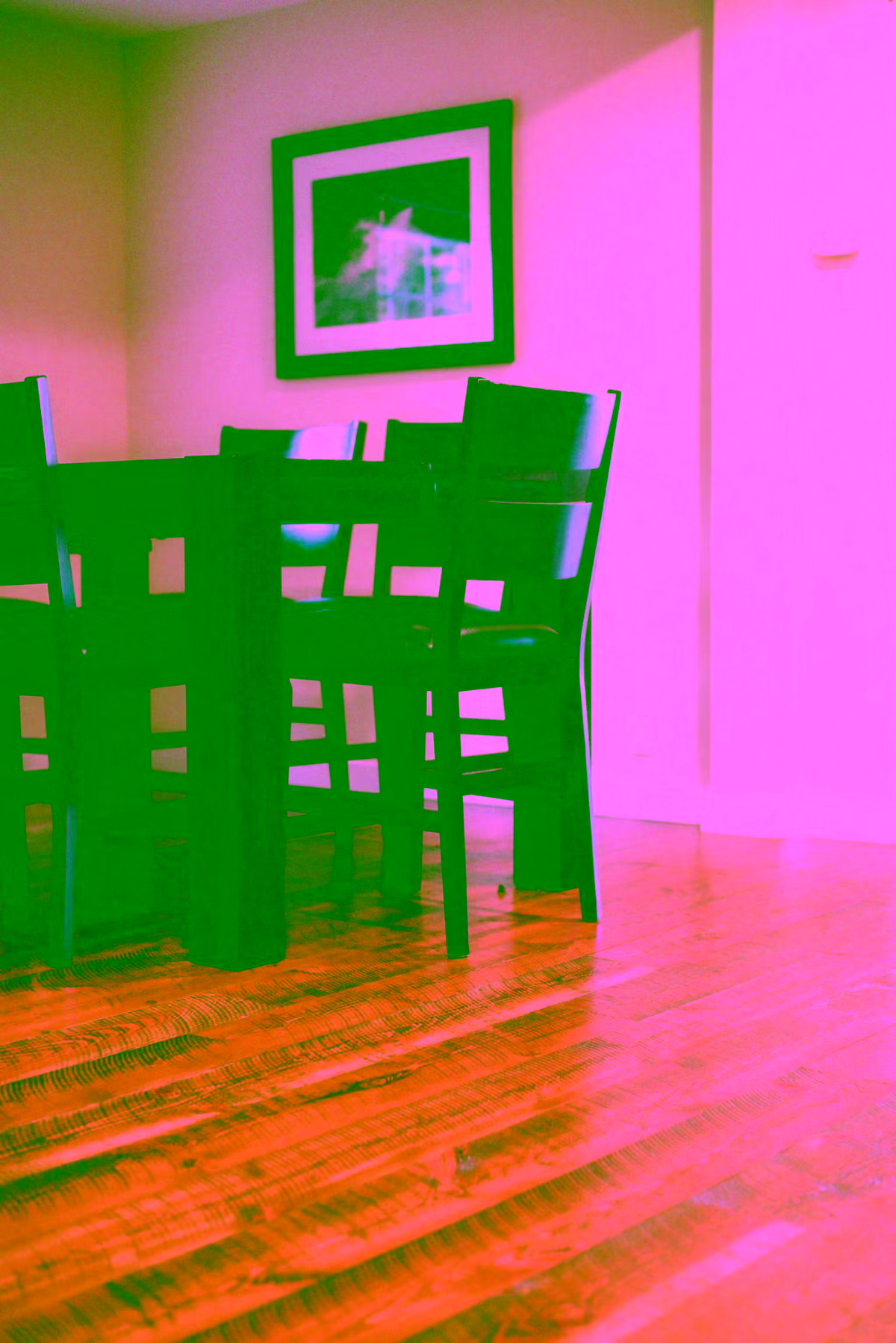 Rustic knotty hardwood floors in a dining room