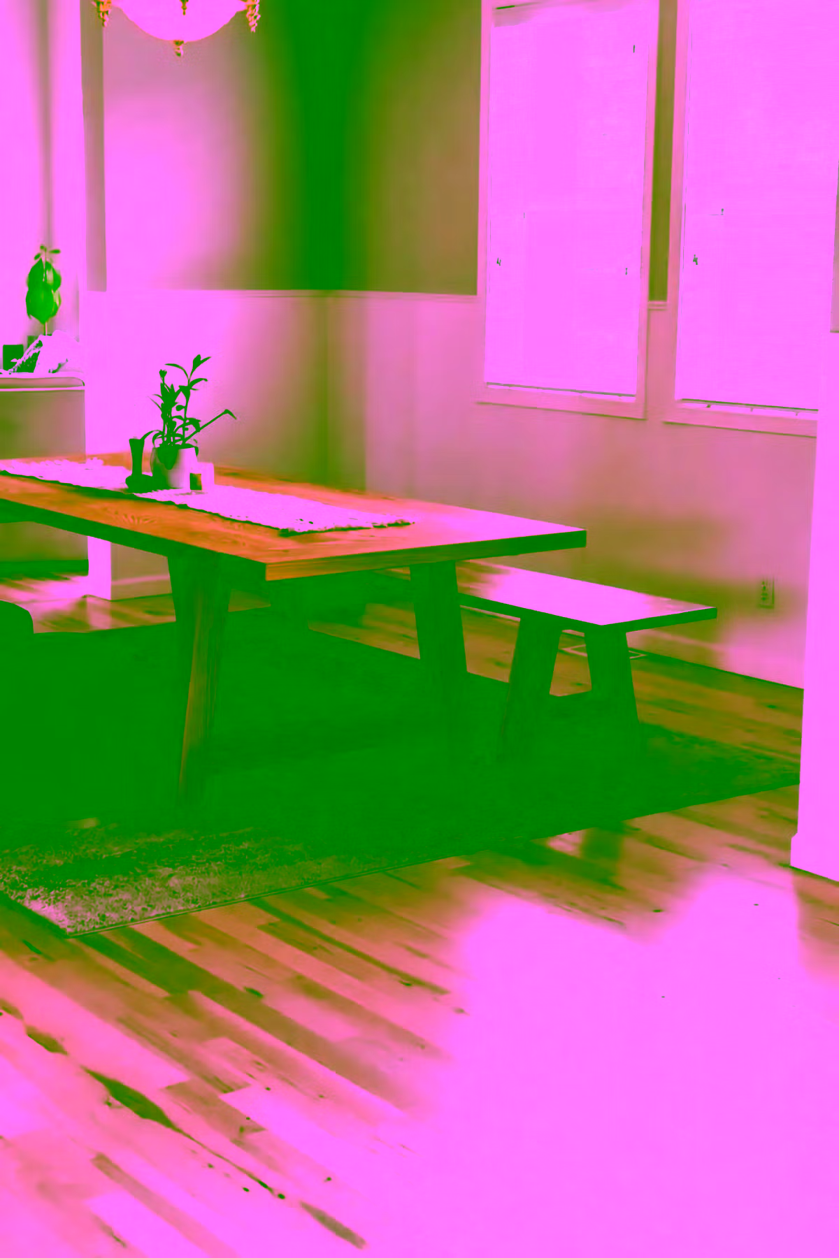 Dining room with light hickory floors and mountain view through large windows